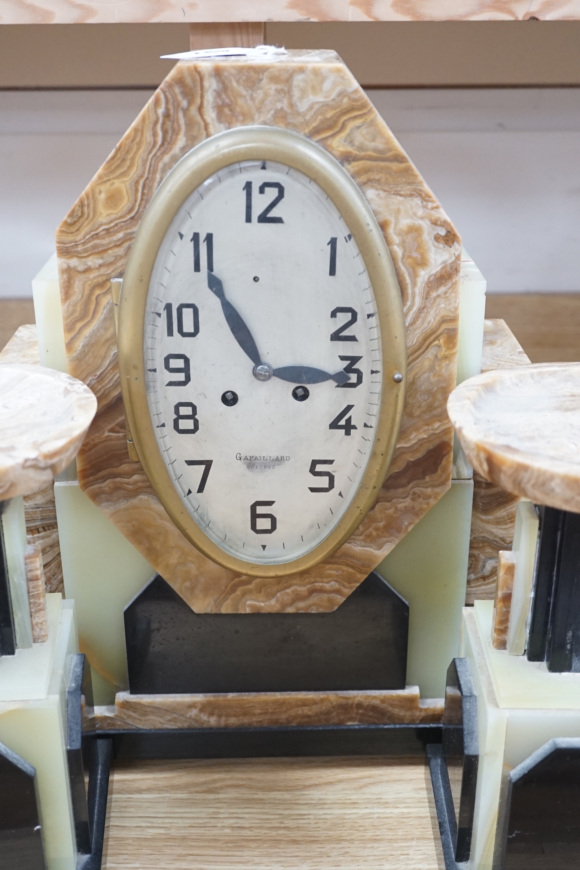 An Art Deco onyx and marble clock garniture, clock 42cms high